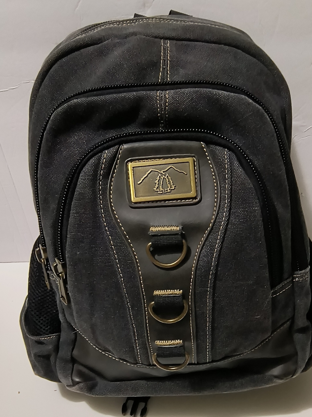 Classic Black Canvas Backpack with Metal Patch